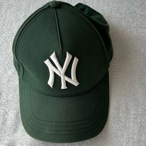 Green and white Yankees baseball cap